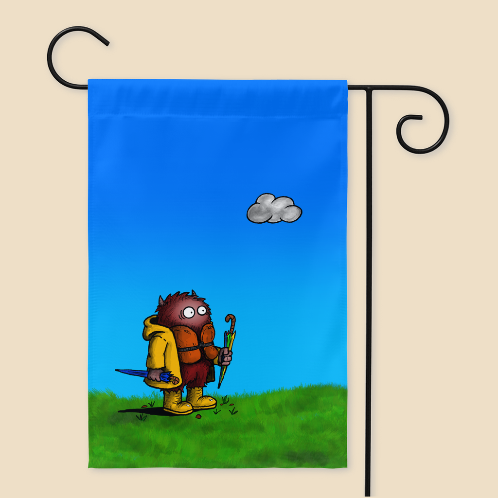 Yard flag featuring a cartoon creature wearing a raincoat, life jacket, and rain boots while carrying two umbrellas and staring nervously at a single cloud overhead, standing on grass beneath a blue sky.