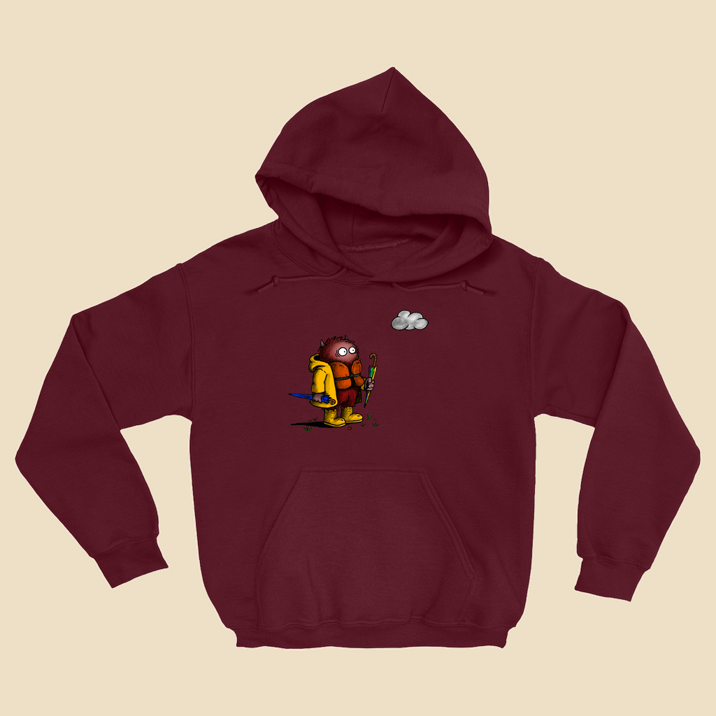 Hoodie featuring a cartoon creature wearing a raincoat, life jacket, and rain boots while carrying two umbrellas and staring nervously at a single cloud overhead.