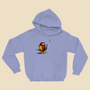 Hoodie featuring a cartoon creature wearing a raincoat, life jacket, and rain boots while carrying two umbrellas and staring nervously at a single cloud overhead.