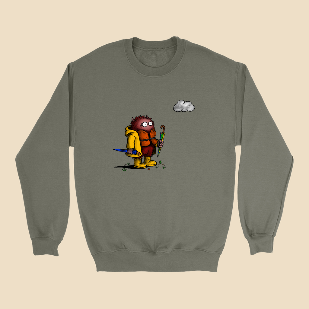 Sweatshirt featuring a cartoon creature wearing a raincoat, life jacket, and rain boots while carrying two umbrellas and staring nervously at a single cloud overhead.