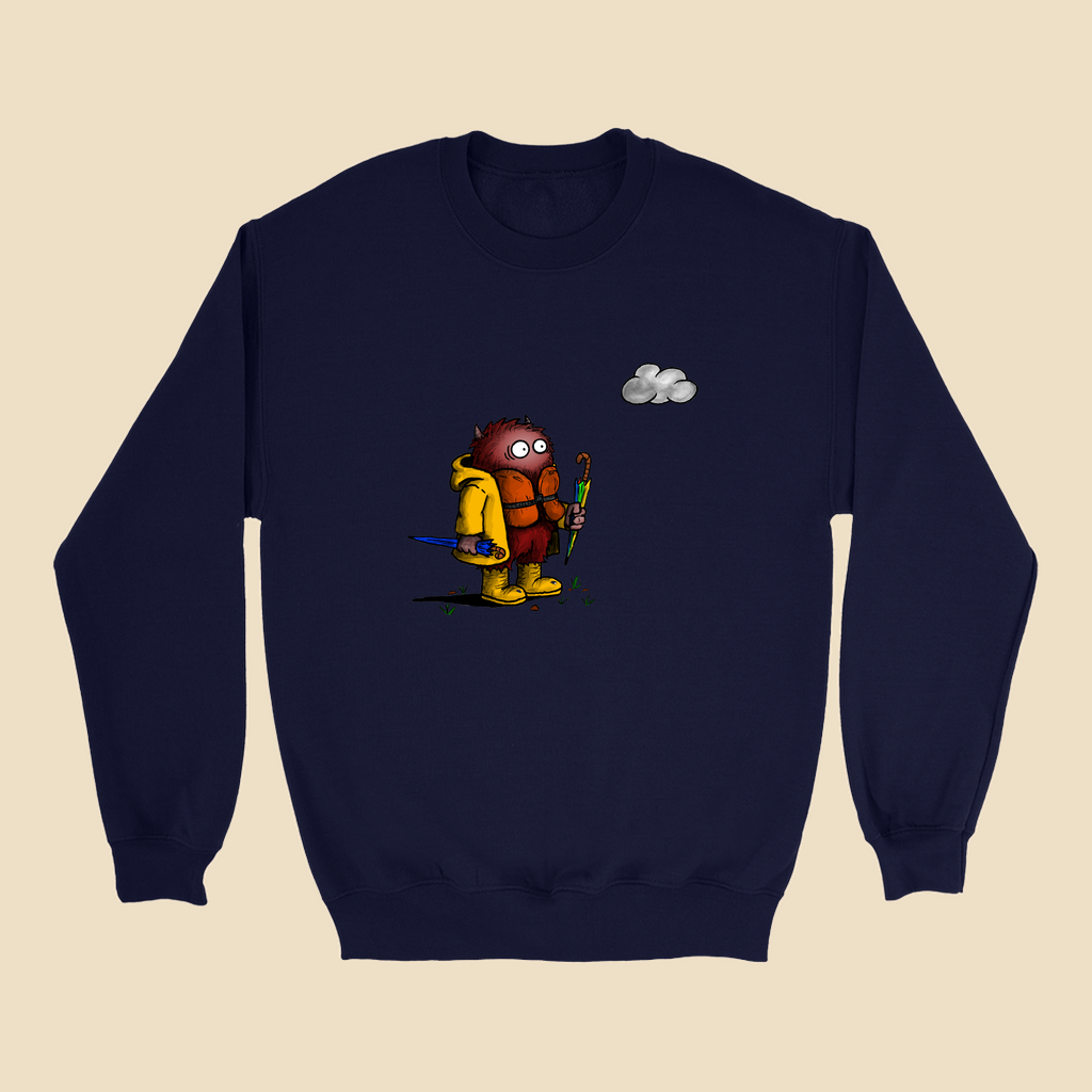 Sweatshirt featuring a cartoon creature wearing a raincoat, life jacket, and rain boots while carrying two umbrellas and staring nervously at a single cloud overhead.