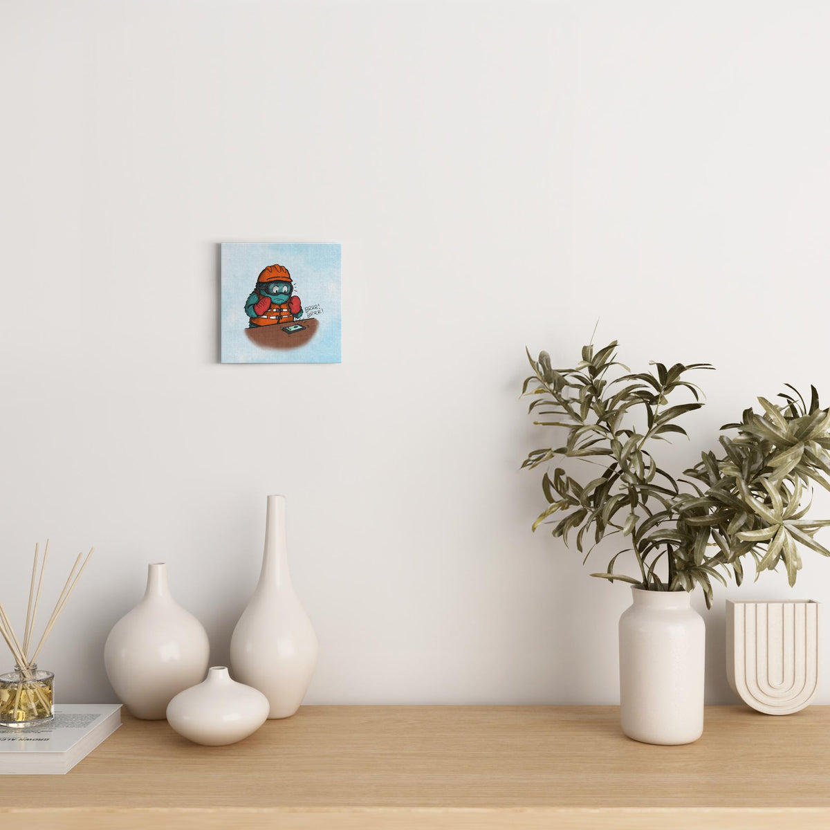 Canvas wrap featuring a furry monster wearing lots of safety gear and panicking as an unexpected phone call comes in.