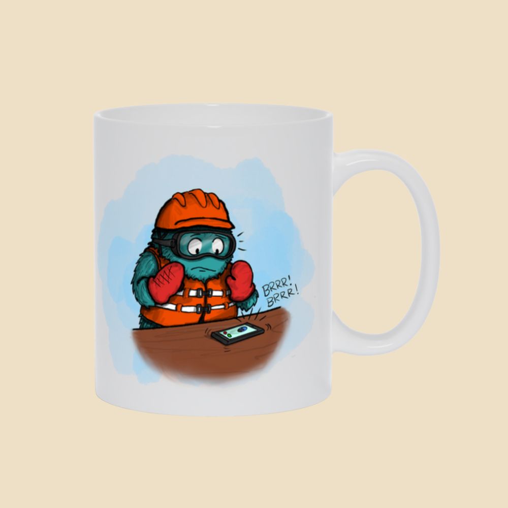 Mug featuring a furry monster wearing lots of safety gear and panicking as an unexpected phone call comes in.