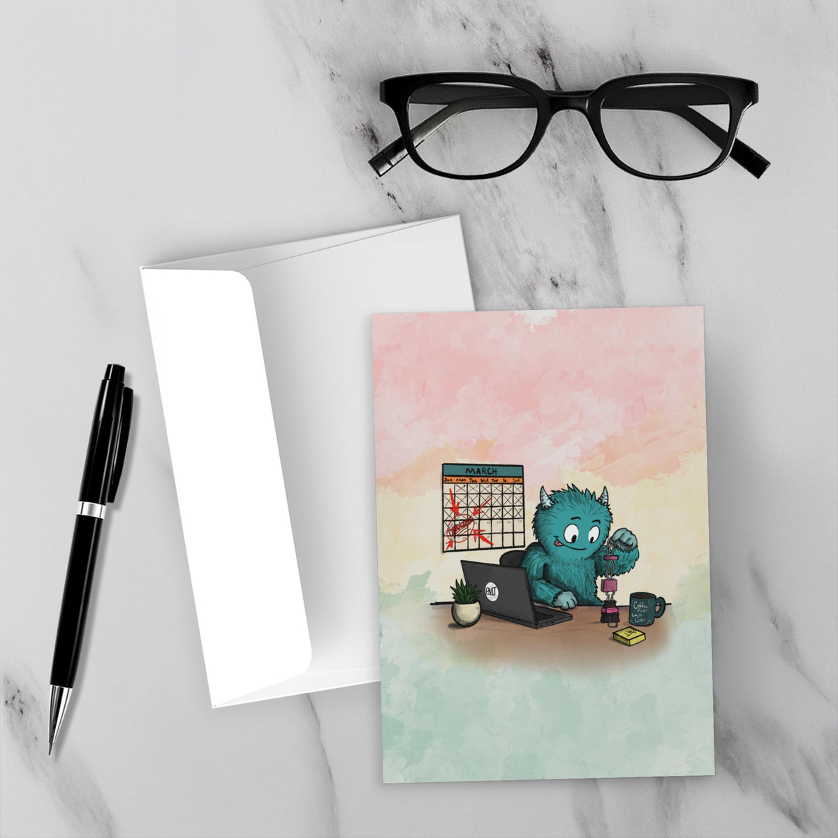 Greeting card featuring a blue furry monster building a tower of office supplies beside a laptop while a calendar full of crossed-off days hangs in the background.