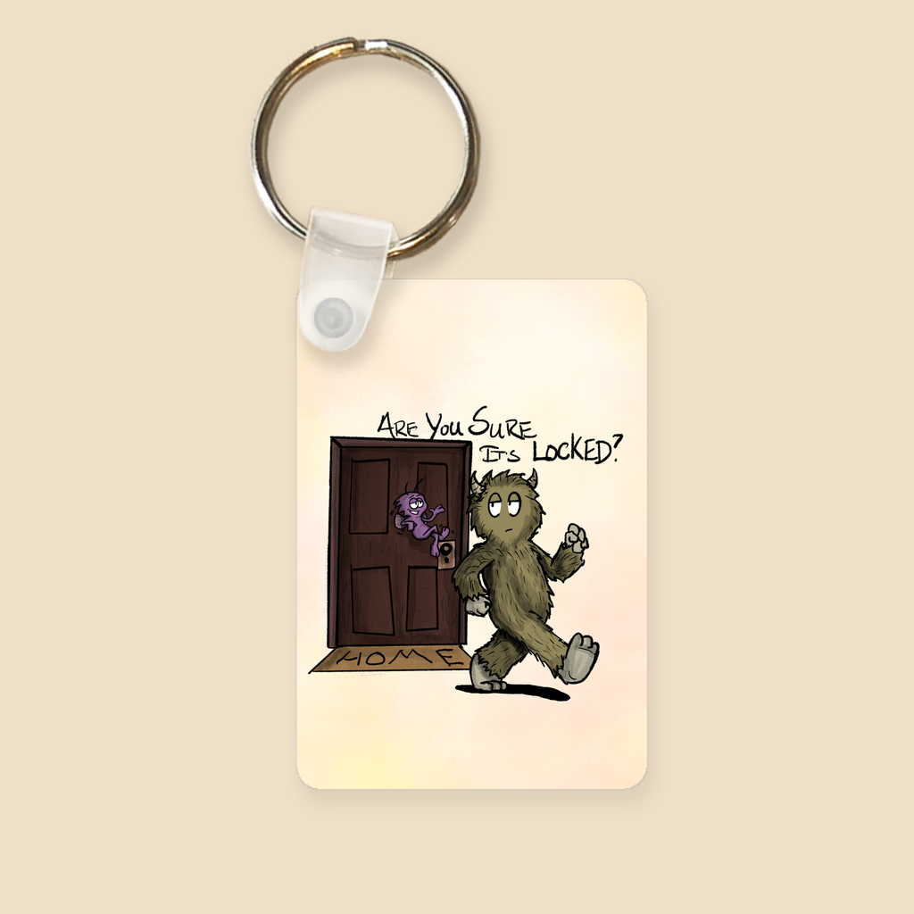 Keychain featuring a furry monster trying to leave the house while a little purple OCD gremlin at the door asks, “Are you sure it’s locked?”