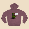 Heather sport dark maroon hoodie featuring a cartoon creature in a green hoodie holding a sign reading “I do not wish to be perceived.”