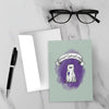 Introvert Costume Contest greeting card featuring a shy monster dressed as a ghost beneath a banner and wearing a first-place ribbon against a purple background.