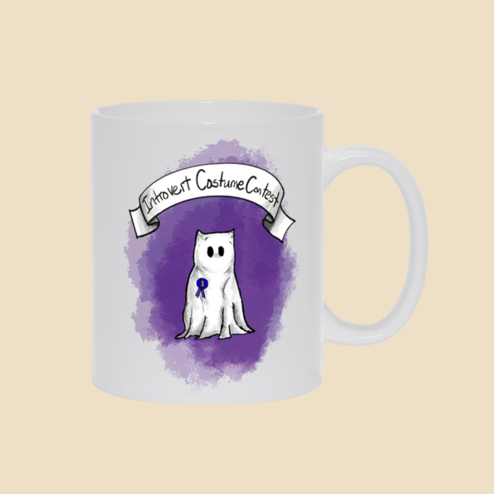 Introvert Costume Contest mug featuring a shy monster dressed as a ghost beneath a banner, wearing a first-place ribbon against a purple background.