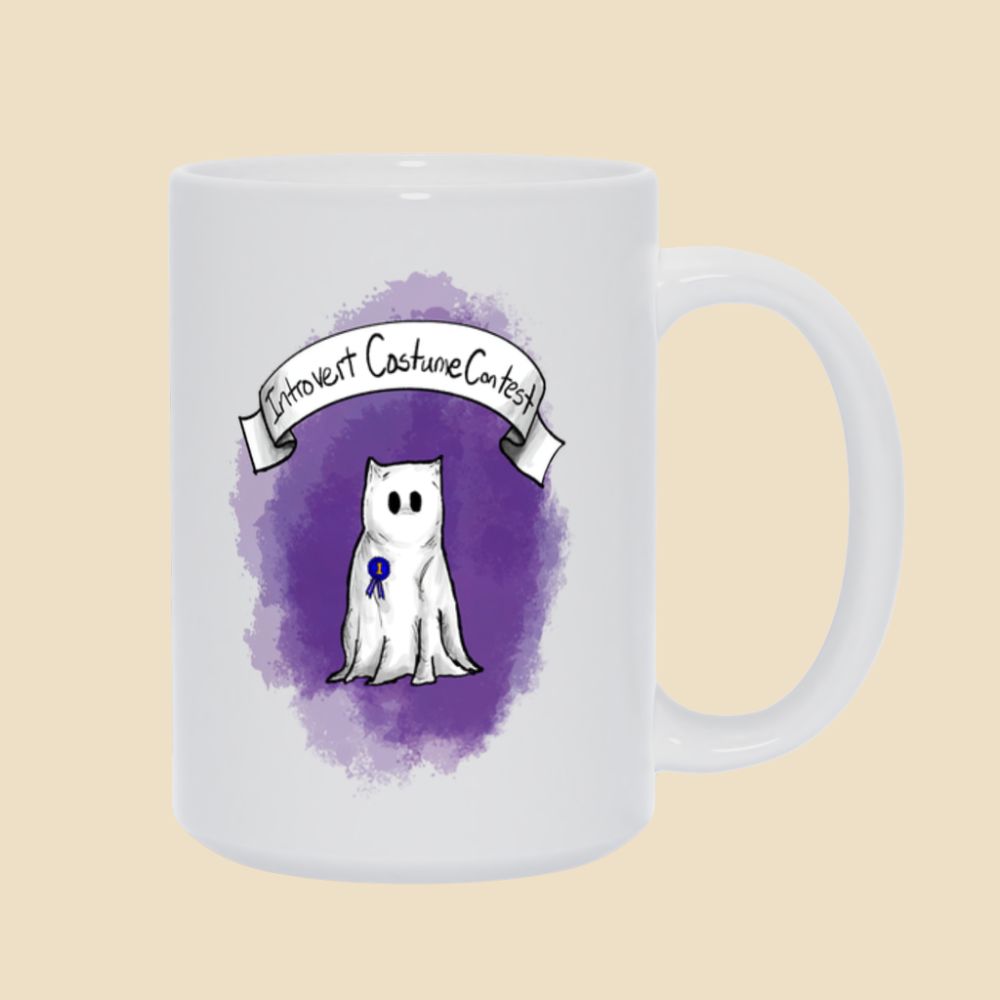 Introvert Costume Contest mug featuring a shy monster dressed as a ghost beneath a banner, wearing a first-place ribbon against a purple background.
