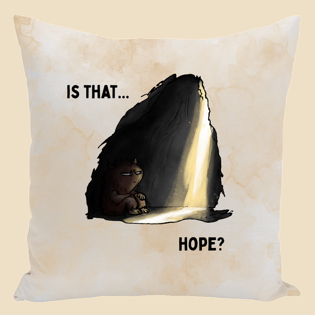 Is That Hope mental health humor throw pillow featuring a tired brown monster sitting in a dark cave as a beam of light breaks through, with the words “Is That... Hope?”