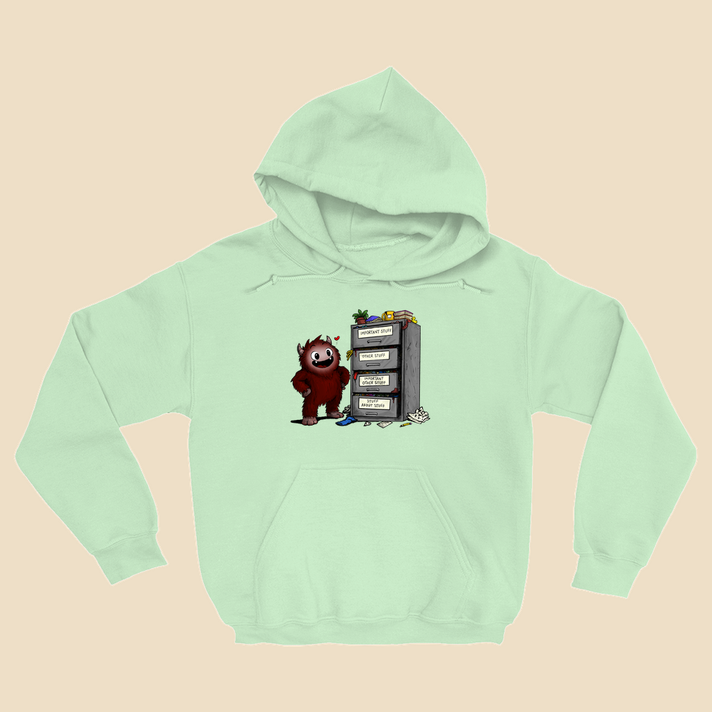 Hoodie featuring a smiling cartoon creature proudly standing beside an overflowing filing cabinet with drawers labeled "Important Stuff," "Other Stuff," "Important Other Stuff," and "Stuff About Stuff."