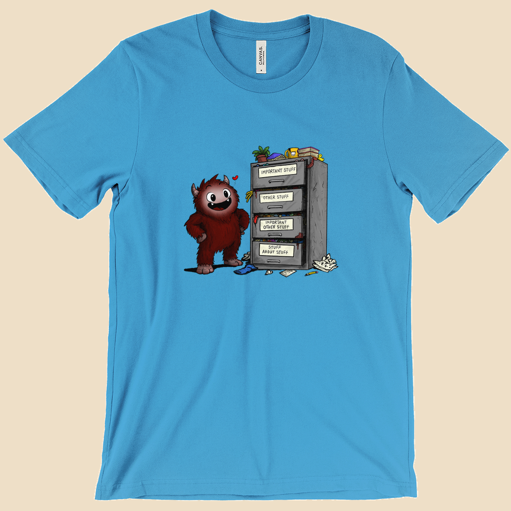 T-shirt featuring a smiling cartoon creature proudly standing beside an overflowing filing cabinet with drawers labeled "Important Stuff," "Other Stuff," "Important Other Stuff," and "Stuff About Stuff."