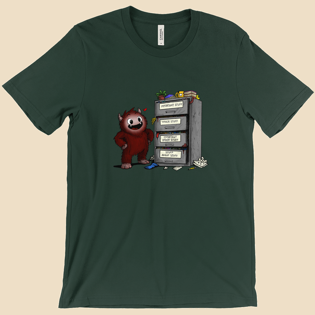 T-shirt featuring a smiling cartoon creature proudly standing beside an overflowing filing cabinet with drawers labeled "Important Stuff," "Other Stuff," "Important Other Stuff," and "Stuff About Stuff."