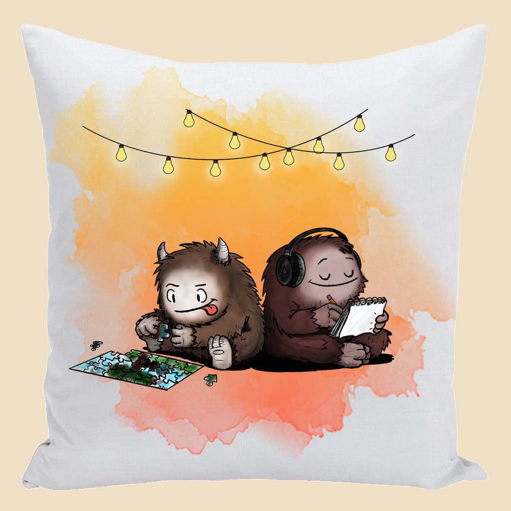 Parallel Play autism throw pillow featuring two cozy monsters sitting back to back, one working on a puzzle and the other writing in a notebook beneath string lights.