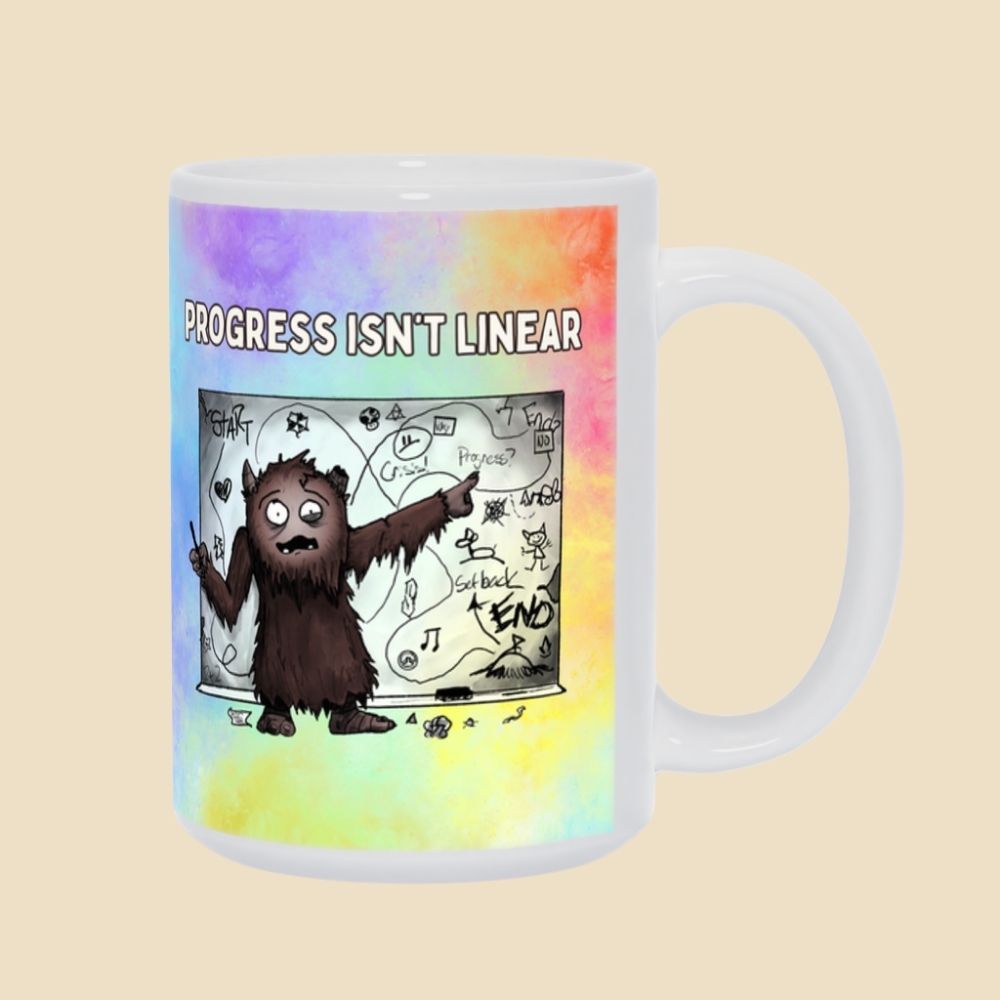 Progress Isn’t Linear mug featuring a furry brown monster pointing at a messy, winding progress chart filled with twists, turns, setbacks, and doodles.