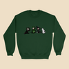 Sweatshirt featuring the Strange Company Halloween design with four hand-drawn costumed characters, including a monster, dinosaur, witch, and ghost.