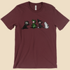 Strange Company Halloween T-shirt featuring a group of furry monsters dressed in Halloween costumes, including a witch, a monster, a dinosaur, and a ghost.