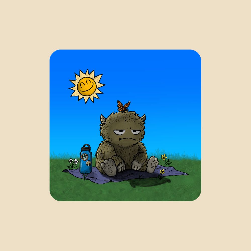 Magnet featuring a furry monster sitting miserably in the sunshine while the cheerful world around it enjoys a beautiful day.