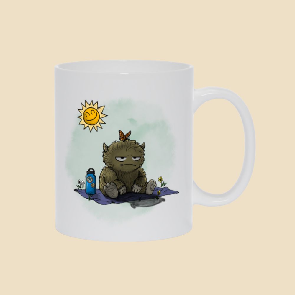 Mug featuring a furry monster sitting miserably in the sunshine while the cheerful world around it enjoys a beautiful day.