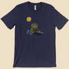 T-shirt featuring a furry monster sitting miserably in the sunshine while the cheerful world around it enjoys a beautiful day.