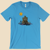 T-shirt featuring a furry monster sitting miserably in the sunshine while the cheerful world around it enjoys a beautiful day.