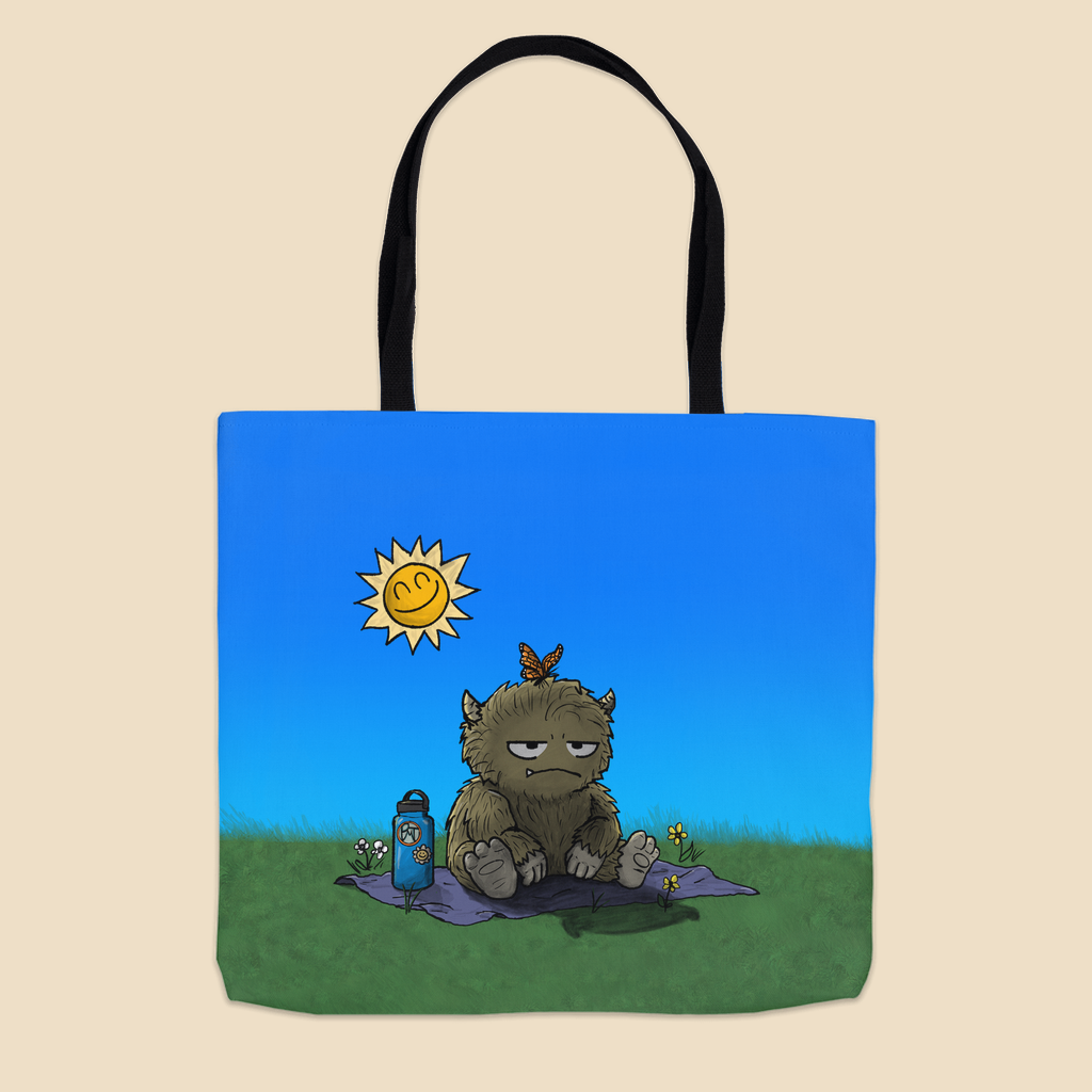 Tote bag featuring a furry monster sitting miserably in the sunshine while the cheerful world around it enjoys a beautiful day.