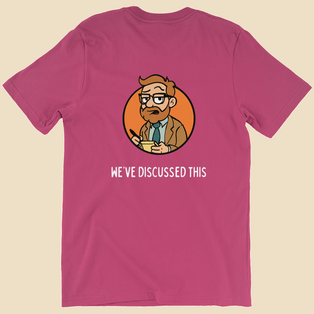 Per My Therapist T-shirt with small white Per My Therapist logo on the front chest and a large Arnold therapist illustration on the back with the words “We’ve Discussed This.”