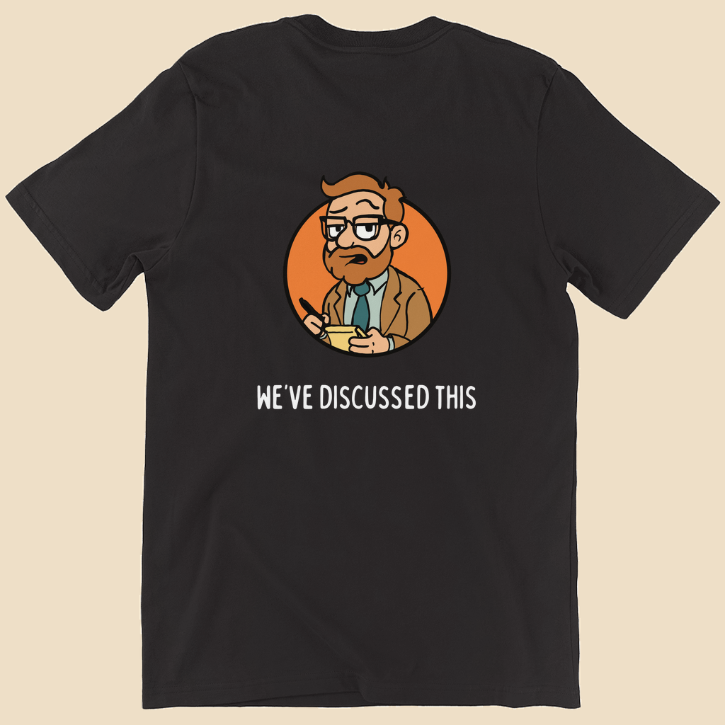 Per My Therapist T-shirt with small white Per My Therapist logo on the front chest and a large Arnold therapist illustration on the back with the words “We’ve Discussed This.”
