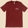 Per My Therapist T-shirt with small white Per My Therapist logo on the front chest and a large Arnold therapist illustration on the back with the words “We’ve Discussed This.”