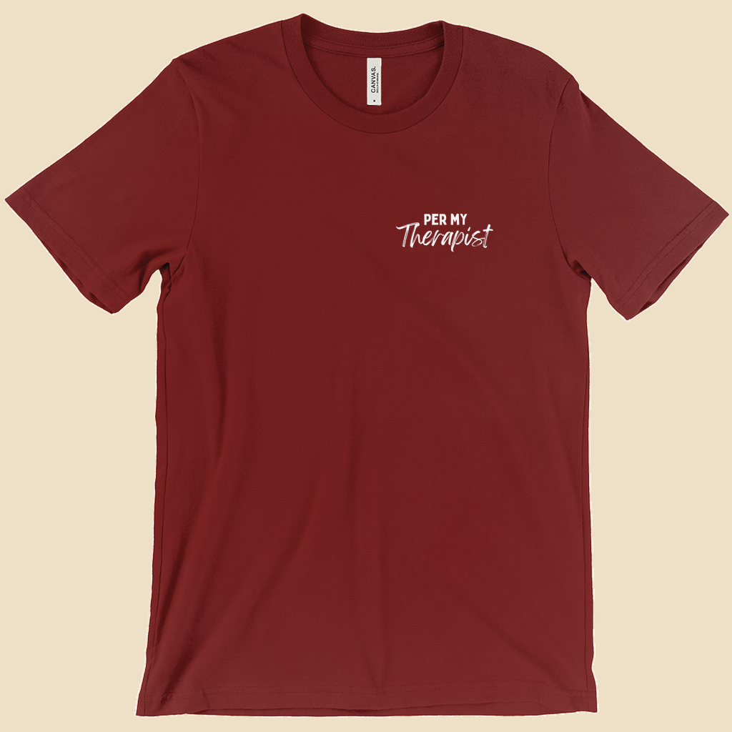 Per My Therapist T-shirt with small white Per My Therapist logo on the front chest and a large Arnold therapist illustration on the back with the words “We’ve Discussed This.”