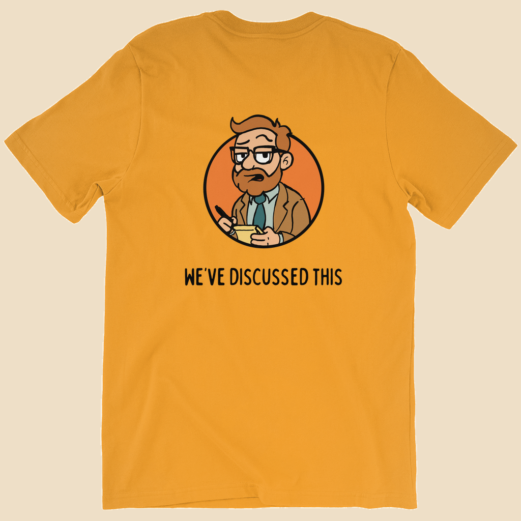 Per My Therapist T-shirt with small black Per My Therapist logo on the front chest and a large Arnold therapist illustration on the back with the words “We’ve Discussed This.”