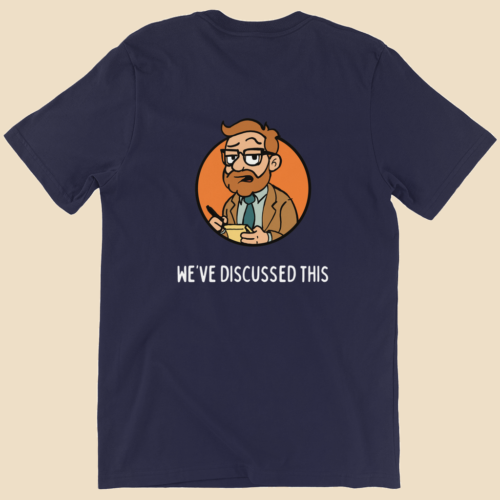 Per My Therapist T-shirt with small white Per My Therapist logo on the front chest and a large Arnold therapist illustration on the back with the words “We’ve Discussed This.”