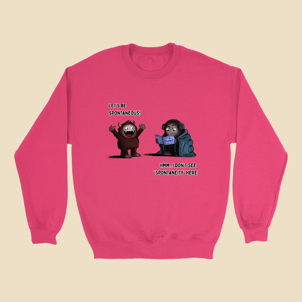 Sweatshirt featuring two cartoon creatures, one saying “Let’s be spontaneous!” while the other checks a planner and replies, “Hmm... I don’t see ‘spontaneity’ here.”